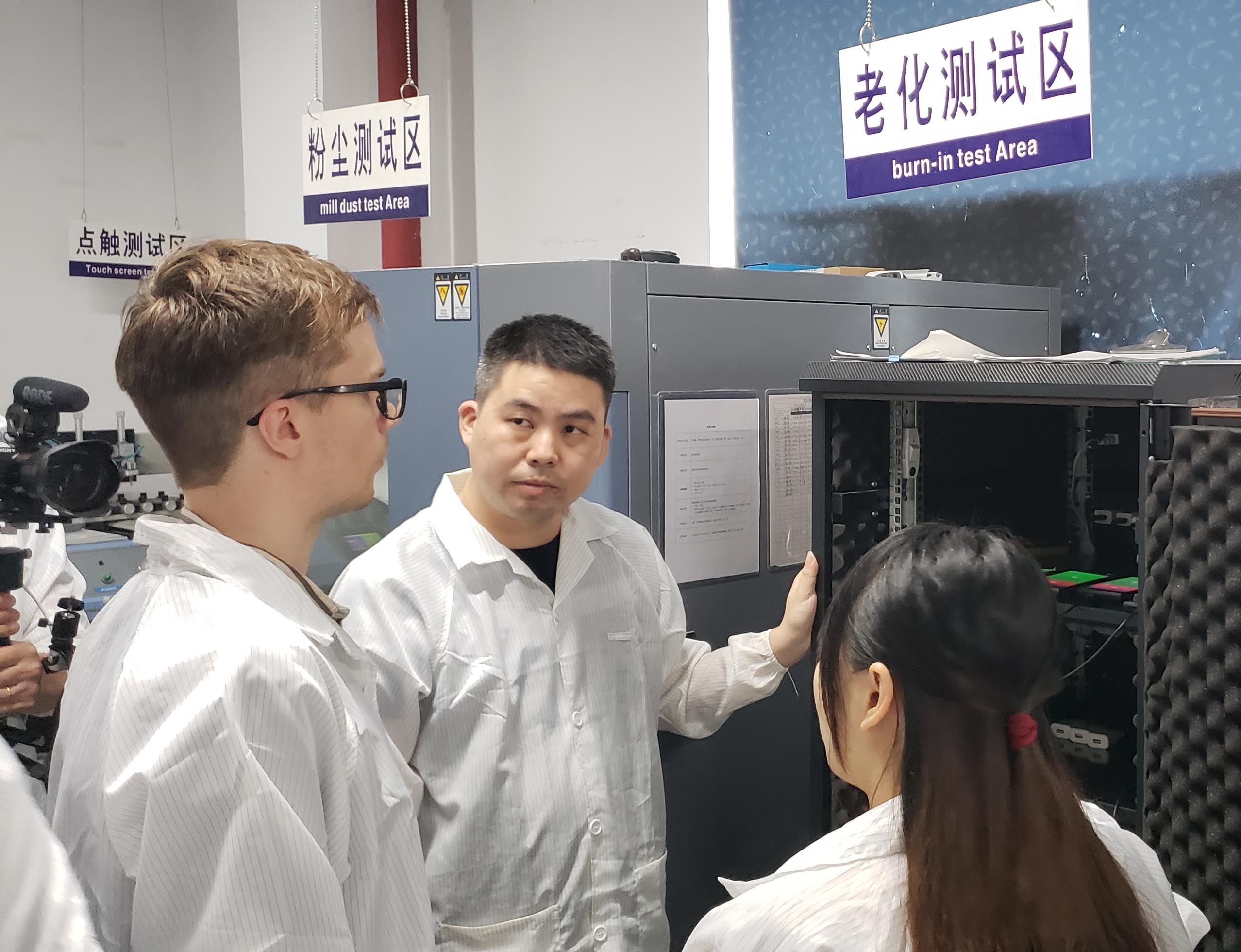 Factory quality control discussion inside a real testing area